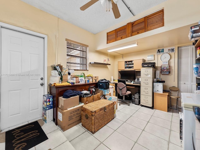 interior space with ceiling fan and a textured ceiling