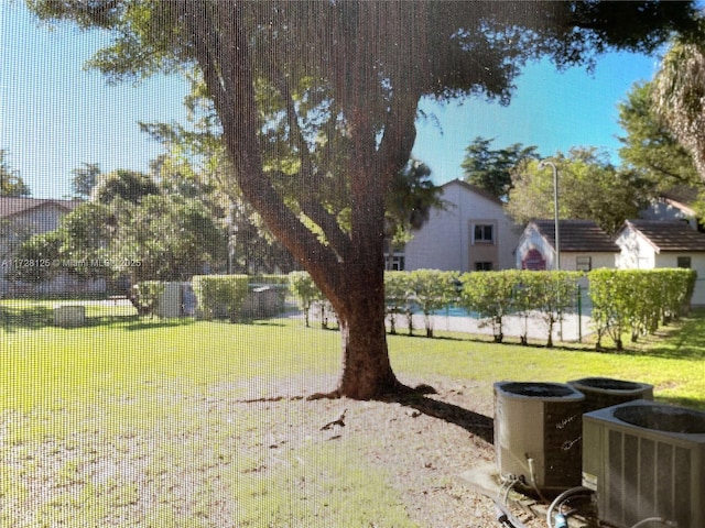 view of yard with central air condition unit