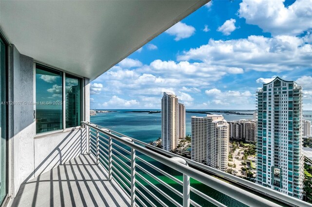 balcony featuring a water view