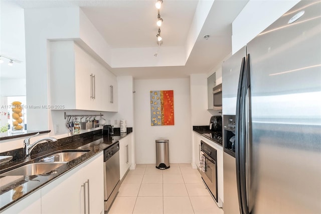 kitchen featuring white cabinets, appliances with stainless steel finishes, and sink