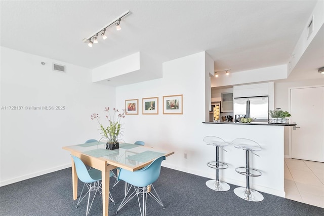 dining room featuring light tile patterned floors