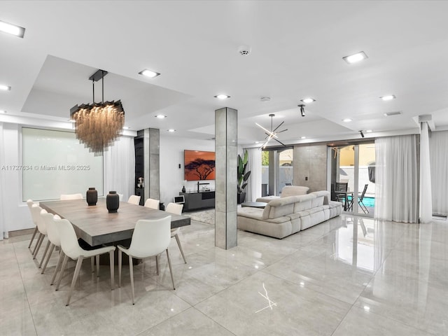 dining space with a notable chandelier