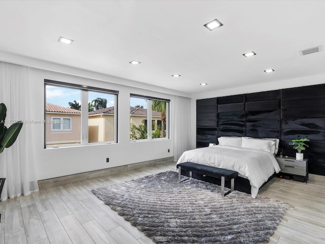 bedroom with light hardwood / wood-style flooring