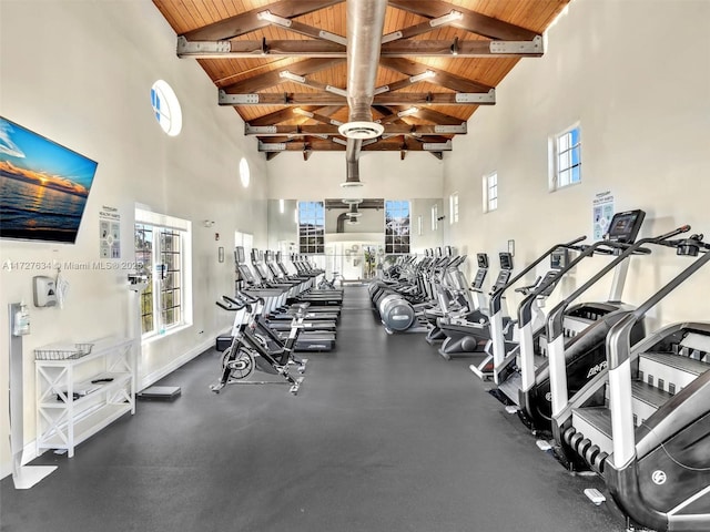 workout area with high vaulted ceiling and wooden ceiling