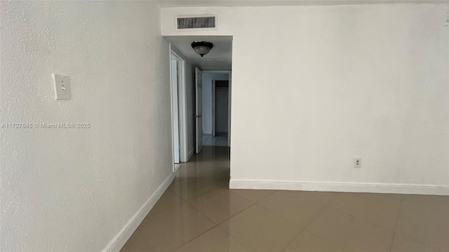 corridor featuring tile patterned floors