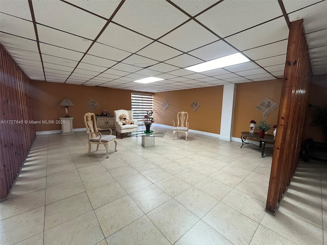 unfurnished room featuring a paneled ceiling