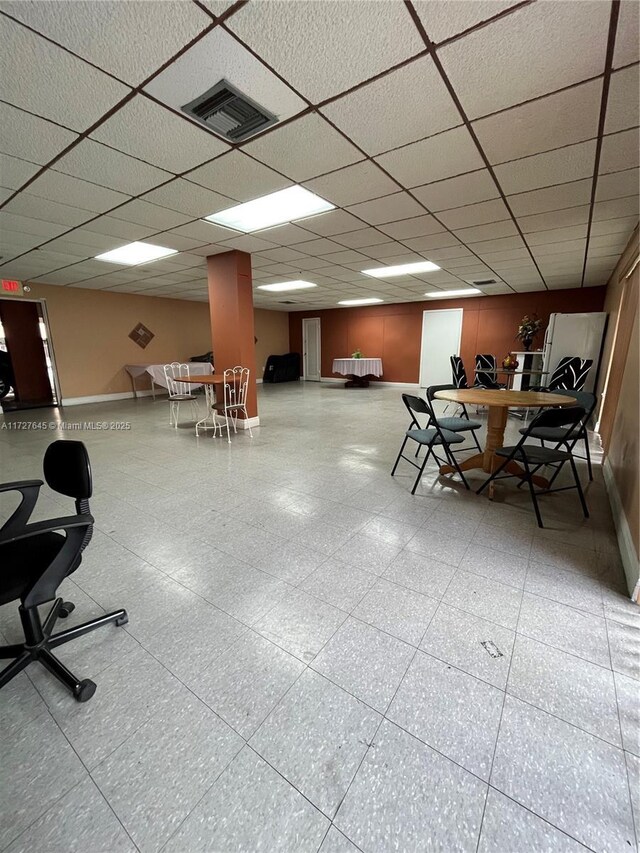 interior space featuring a paneled ceiling