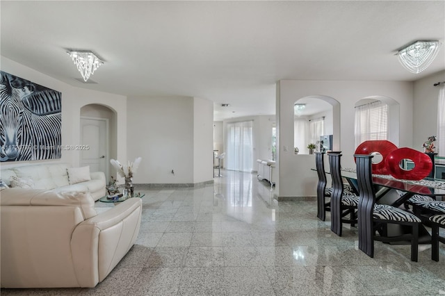 living room with an inviting chandelier