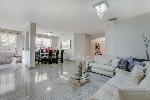 living room with a chandelier