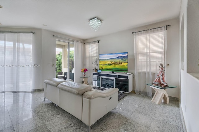 living room featuring plenty of natural light