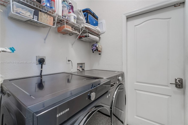 washroom with washing machine and dryer