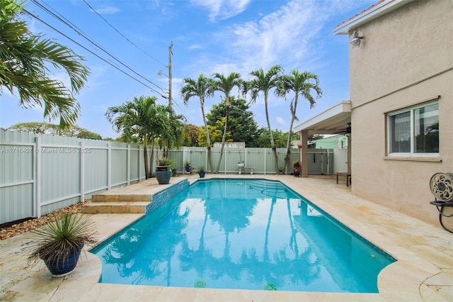 view of swimming pool with a fenced in pool, a patio area, and a fenced backyard