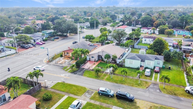 birds eye view of property with a residential view