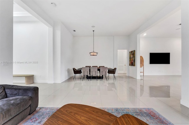 living room with tile patterned flooring and baseboards