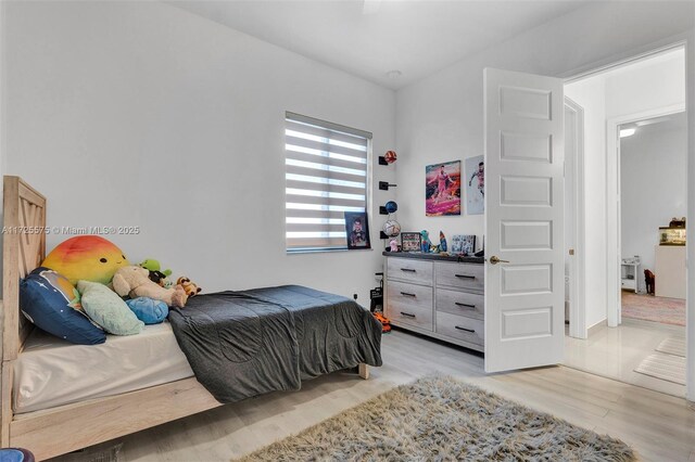 bedroom with light hardwood / wood-style flooring