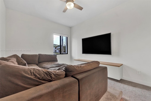 carpeted living room featuring ceiling fan