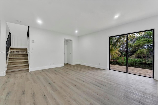 unfurnished living room with light hardwood / wood-style floors