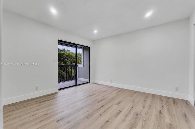 unfurnished room with light wood-type flooring