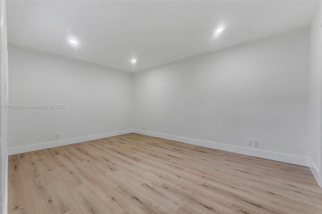 spare room featuring light hardwood / wood-style flooring