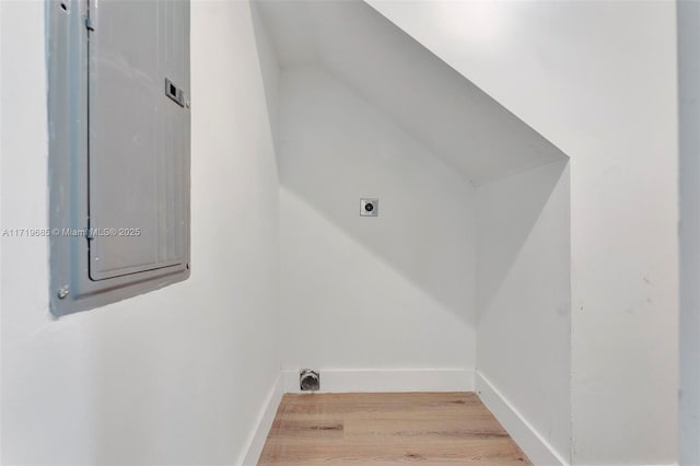 laundry room with electric panel and hookup for an electric dryer