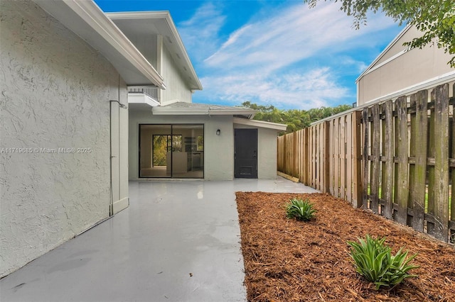 doorway to property featuring a patio area