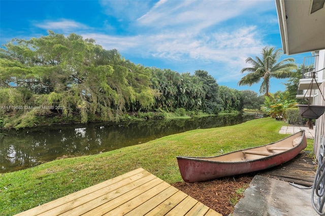 exterior space with a lawn and a water view