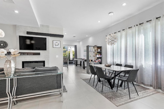 dining room featuring tile patterned floors and an inviting chandelier