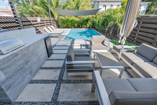 view of swimming pool with an outdoor hangout area and a patio area