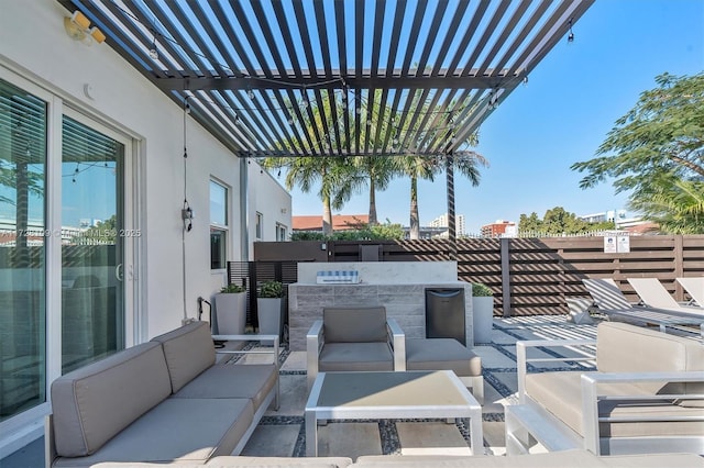 view of patio with an outdoor living space and a pergola