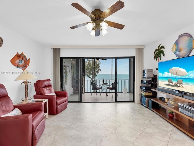 living room featuring light tile patterned floors and ceiling fan