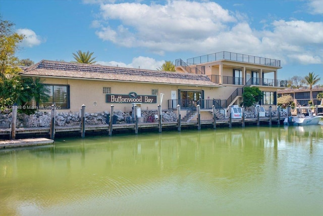 back of property with a water view