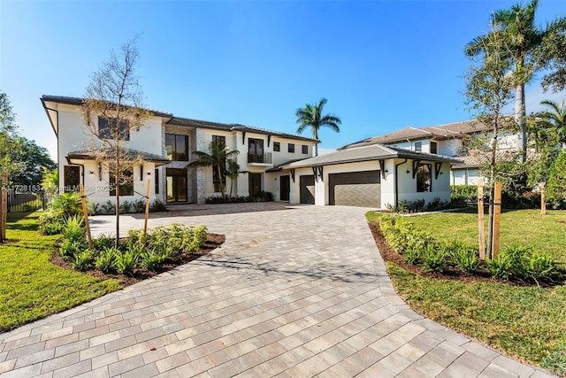 view of front facade featuring a front yard and a garage