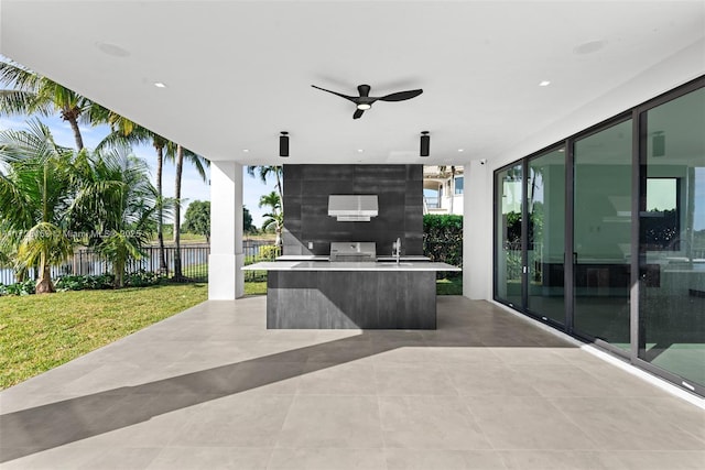 view of patio / terrace with grilling area, ceiling fan, and sink