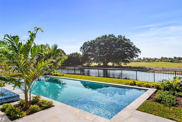 view of pool featuring a water view