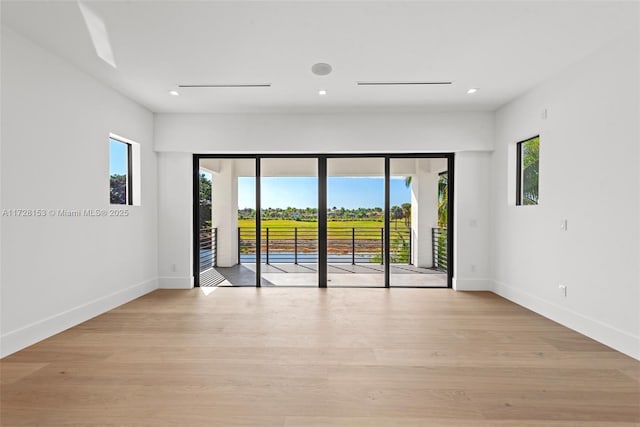 spare room with light wood-type flooring