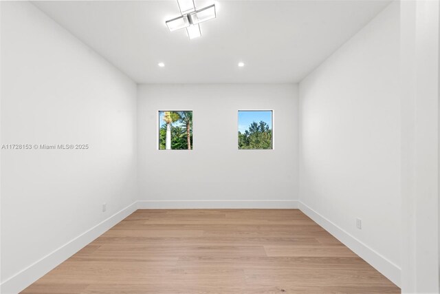 unfurnished room with light hardwood / wood-style flooring