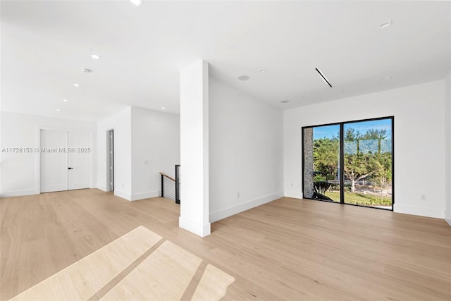 unfurnished room featuring light hardwood / wood-style floors