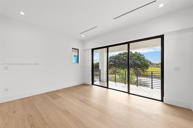 spare room with light wood-type flooring