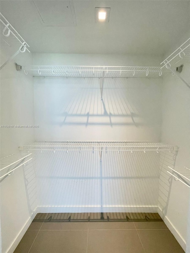 walk in closet featuring tile patterned floors