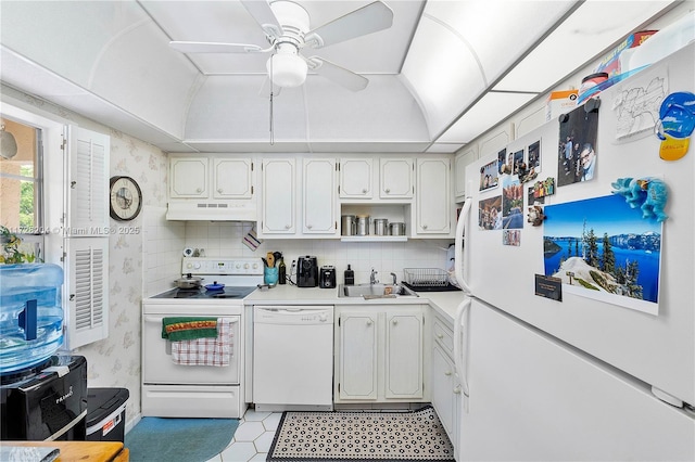 kitchen with white cabinetry, ceiling fan, backsplash, white appliances, and sink