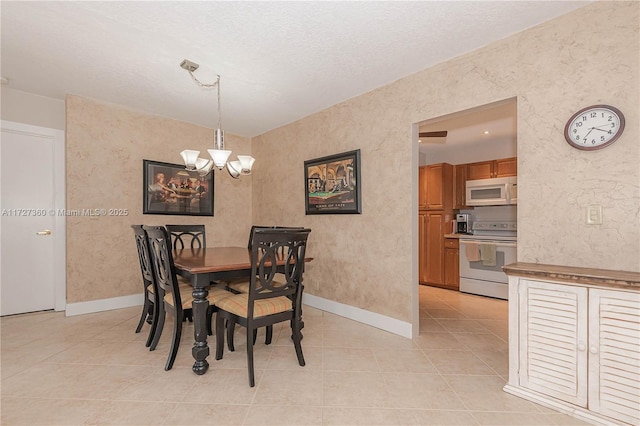 dining room featuring light tile patterned flooring and an inviting chandelier