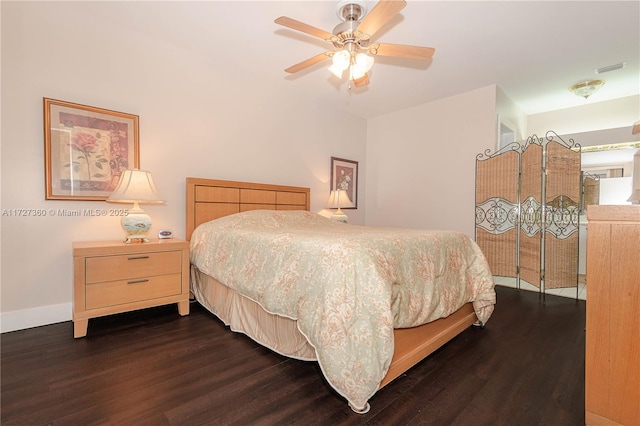 bedroom featuring ceiling fan and dark hardwood / wood-style flooring