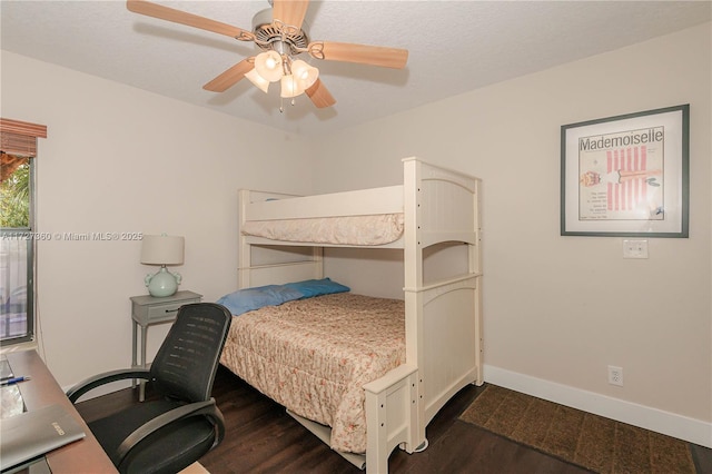 bedroom with ceiling fan and dark hardwood / wood-style floors