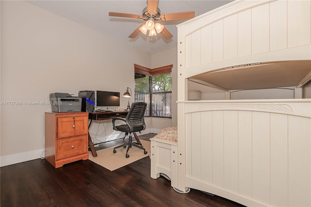 bedroom with dark hardwood / wood-style floors