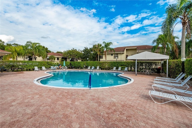 view of swimming pool featuring a gazebo and a patio