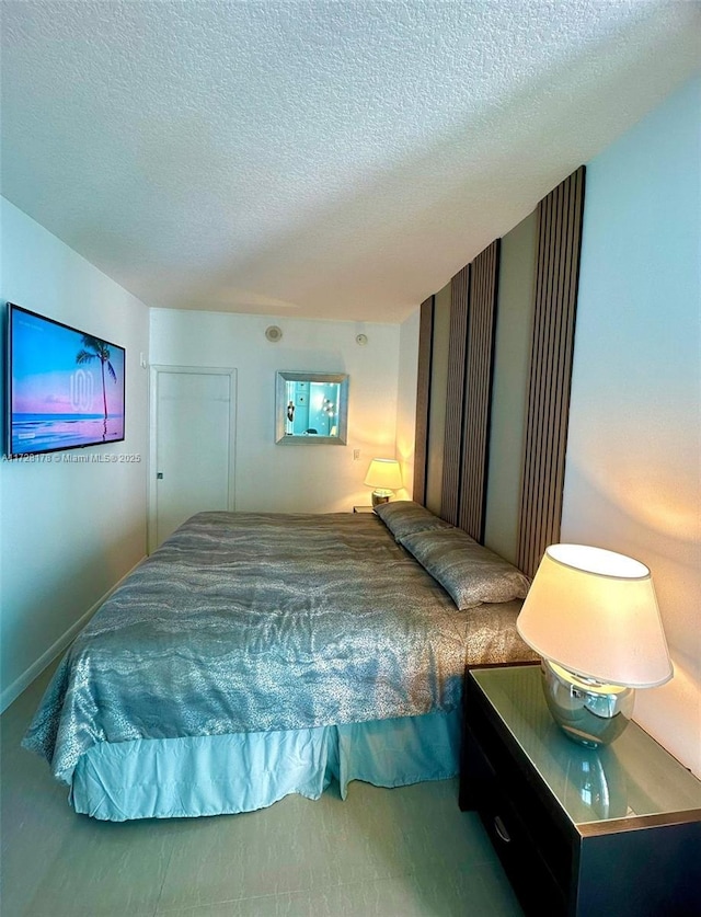 bedroom featuring a textured ceiling