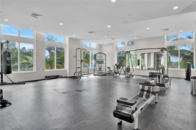 workout area with recessed lighting, visible vents, and baseboards