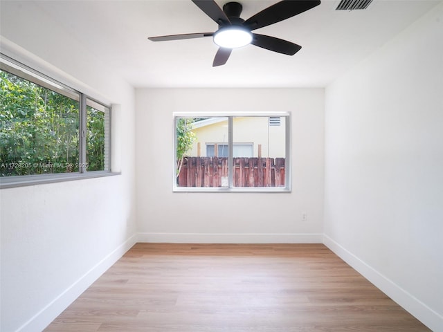 unfurnished room with ceiling fan and light hardwood / wood-style floors