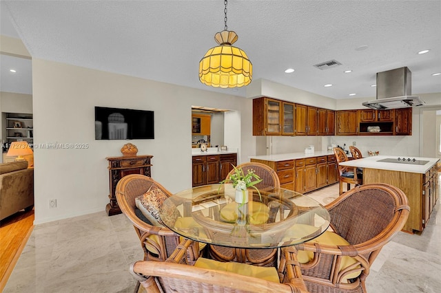 dining area with a textured ceiling