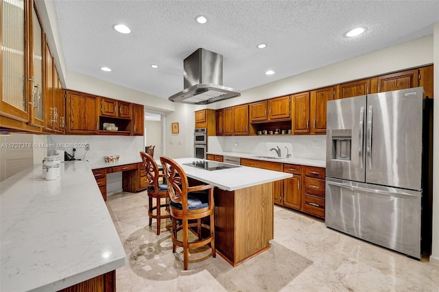 kitchen with a center island, a kitchen bar, island exhaust hood, stainless steel appliances, and sink